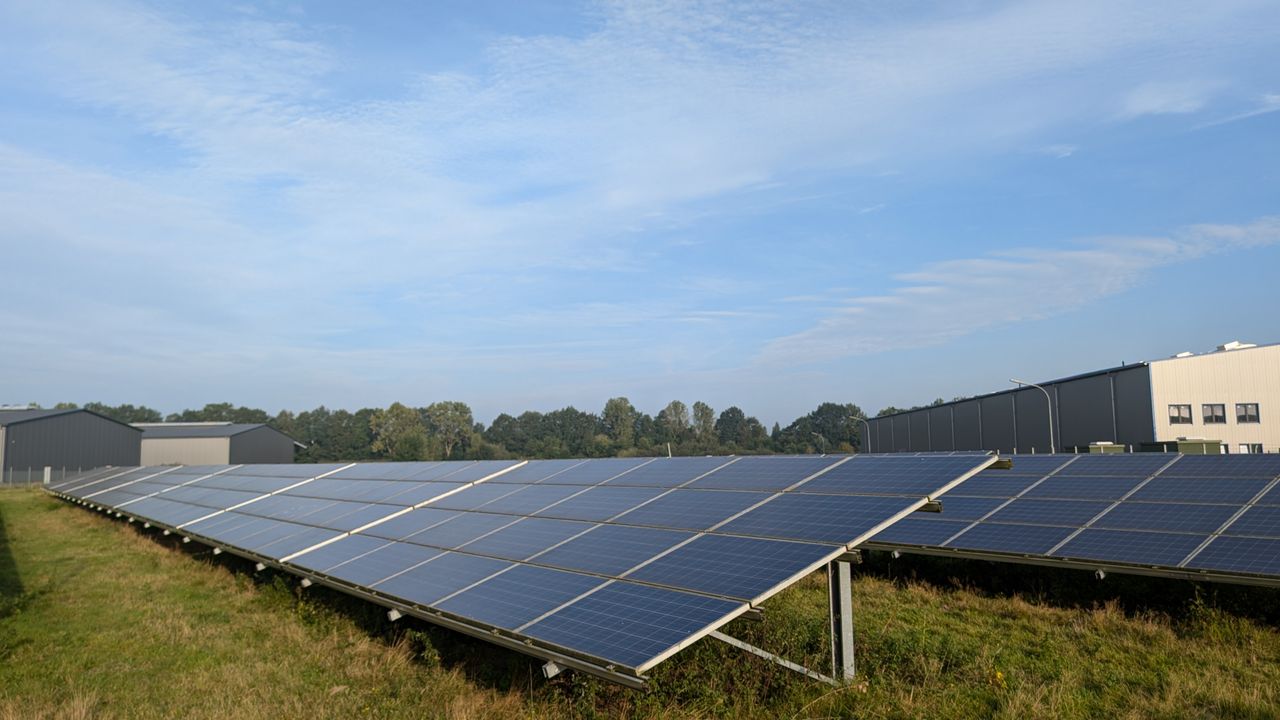 Home Solar panels in a Ratzeburg field, capturing renewable energy on a clear day.